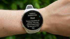 A Garmin Forerunner 965 watch displaying a suggestion to rest after a day of activity.