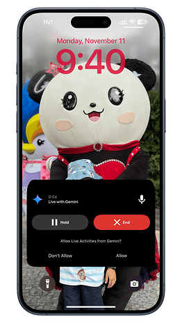 Un écran de smartphone affichant la notification 'En direct avec Gemini' à 9h40 le 11 novembre.